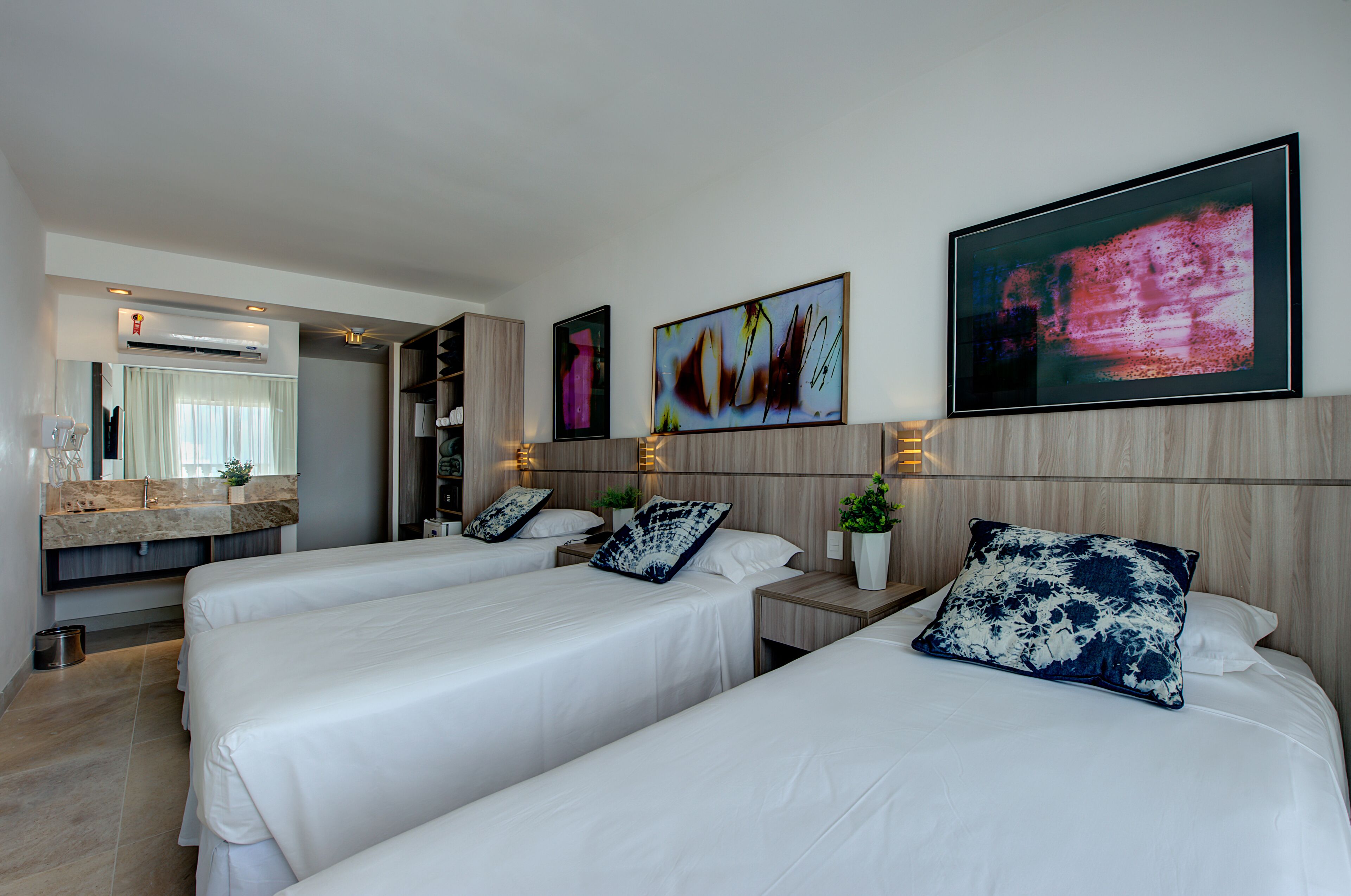 deluxe triple room, sea view | minibar, in-room safe, desk, blackout curtains