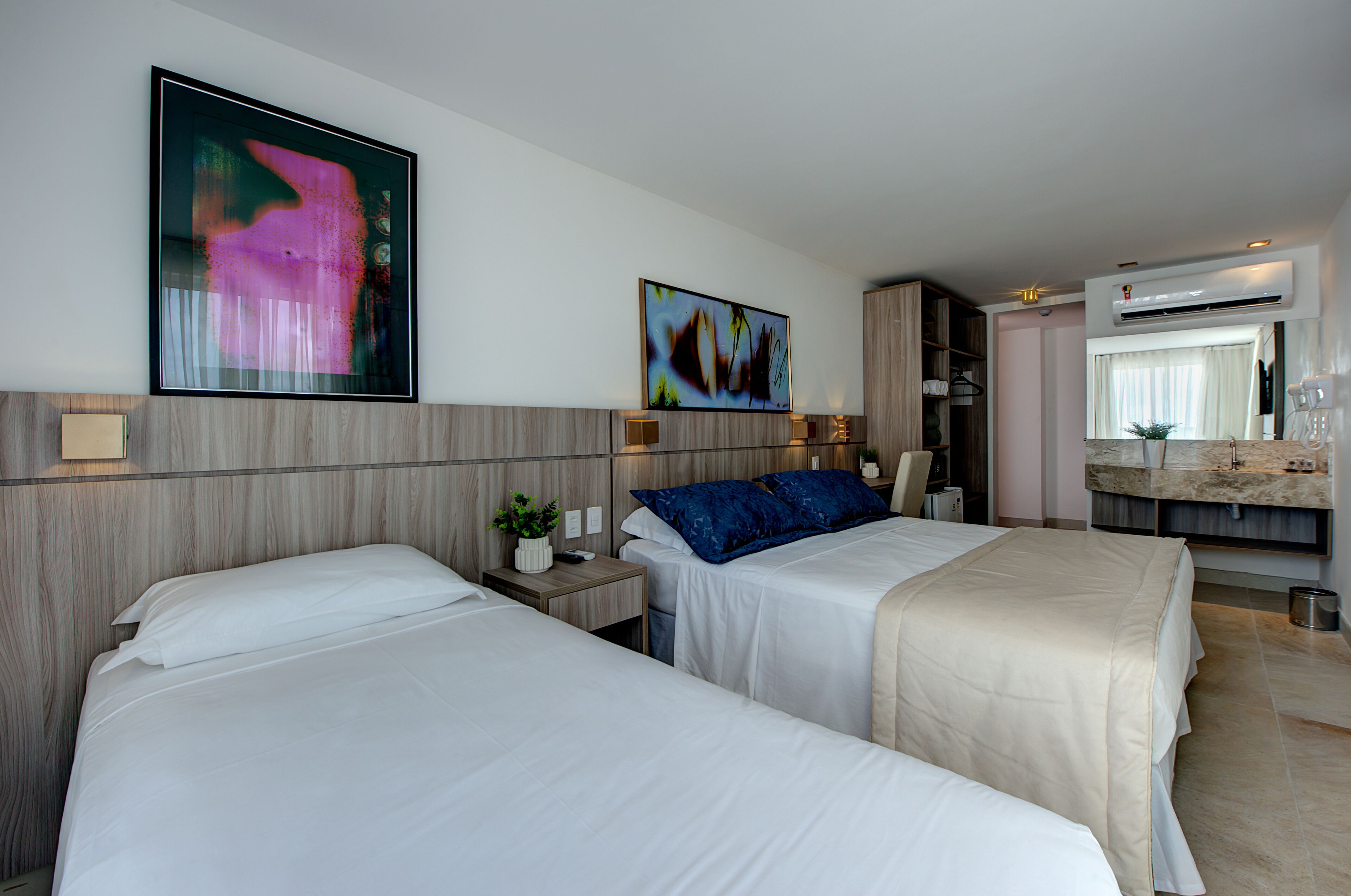 deluxe triple room, sea view | minibar, in-room safe, desk, blackout curtains