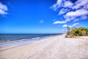 On the beach, sun-loungers, beach umbrellas, beach towels