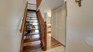 A wooden staircase with a wooden railing leading to a landing. - 3 Mi to Titanic Museum: Branson Condo w/ Fireplace (Branson)