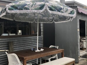 Outdoor dining - Unplug and reconnect at a kiwiana bach - 2020 finalist Bach of the year awards  (Foxton Beach)