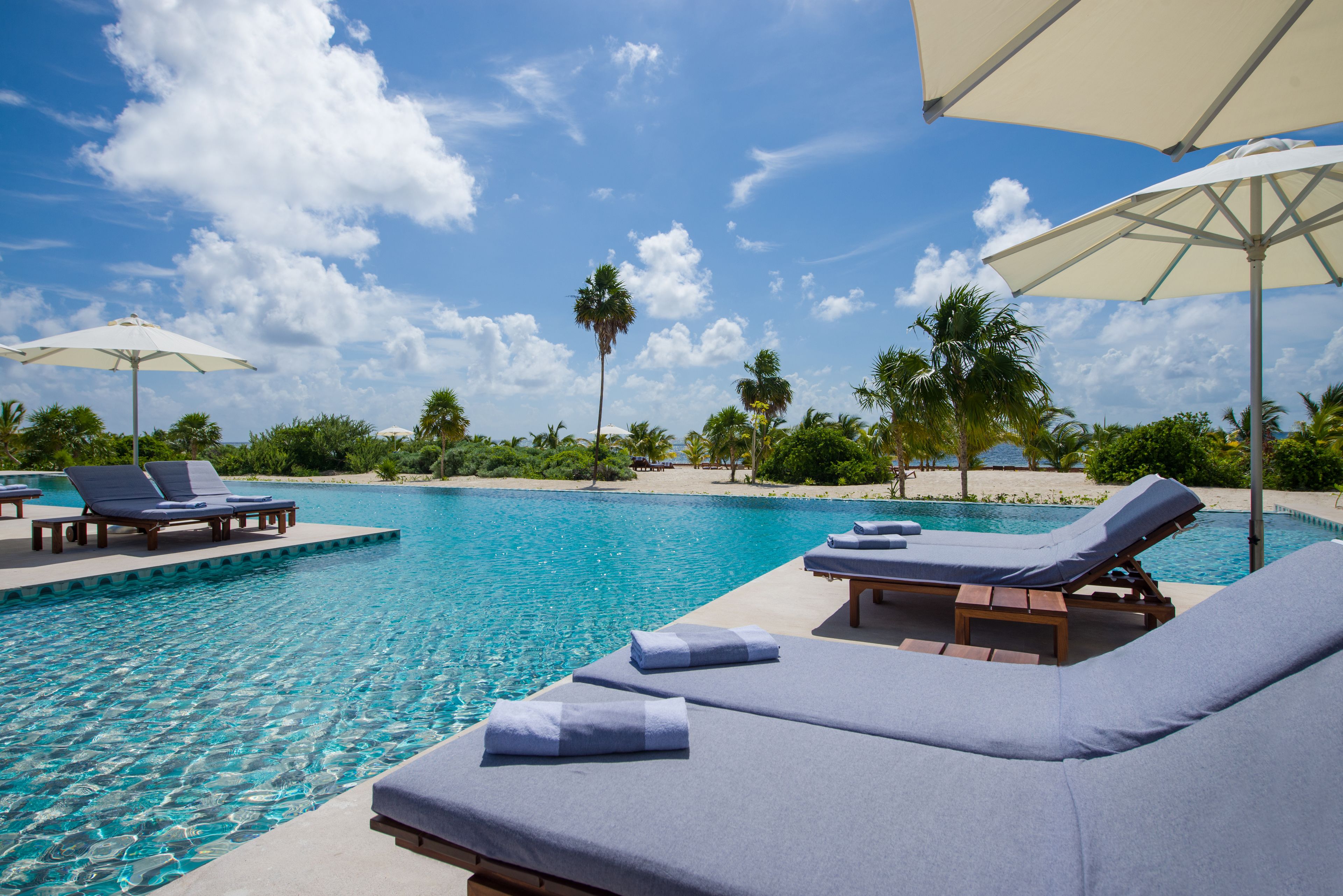 2 outdoor pools, open 7:00 am to 7:00 pm, pool umbrellas, pool loungers