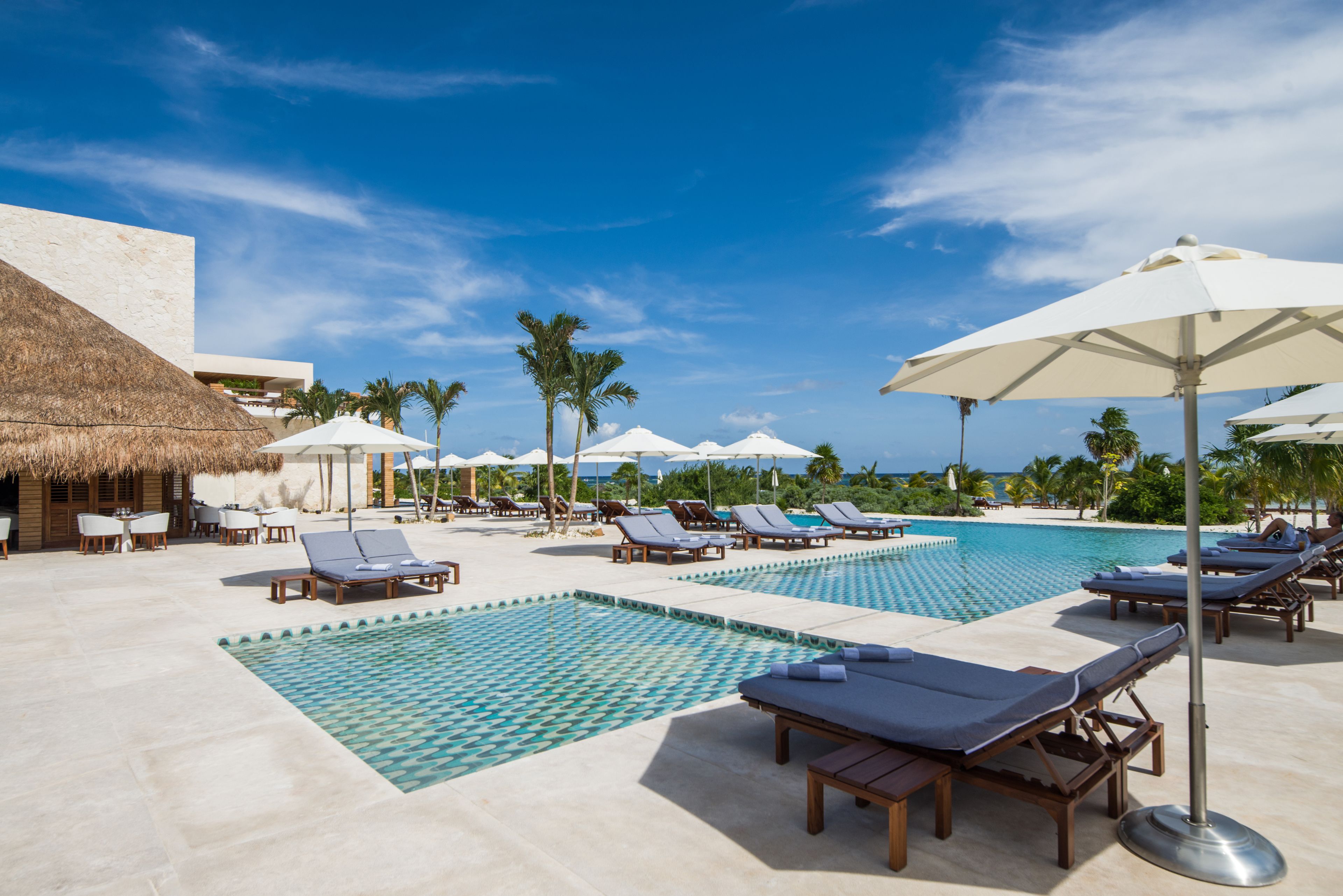 2 outdoor pools, open 7:00 am to 7:00 pm, pool umbrellas, pool loungers