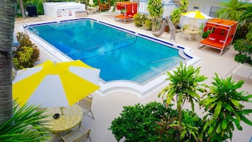 Outdoor pool, a heated pool, free pool cabanas, pool umbrellas