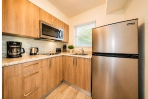 Deluxe Studio, 1 King Bed, Kitchen | Private kitchen | Microwave, coffee/tea maker, electric kettle - Club Lux Resort By the Beach (Deerfield Beach)