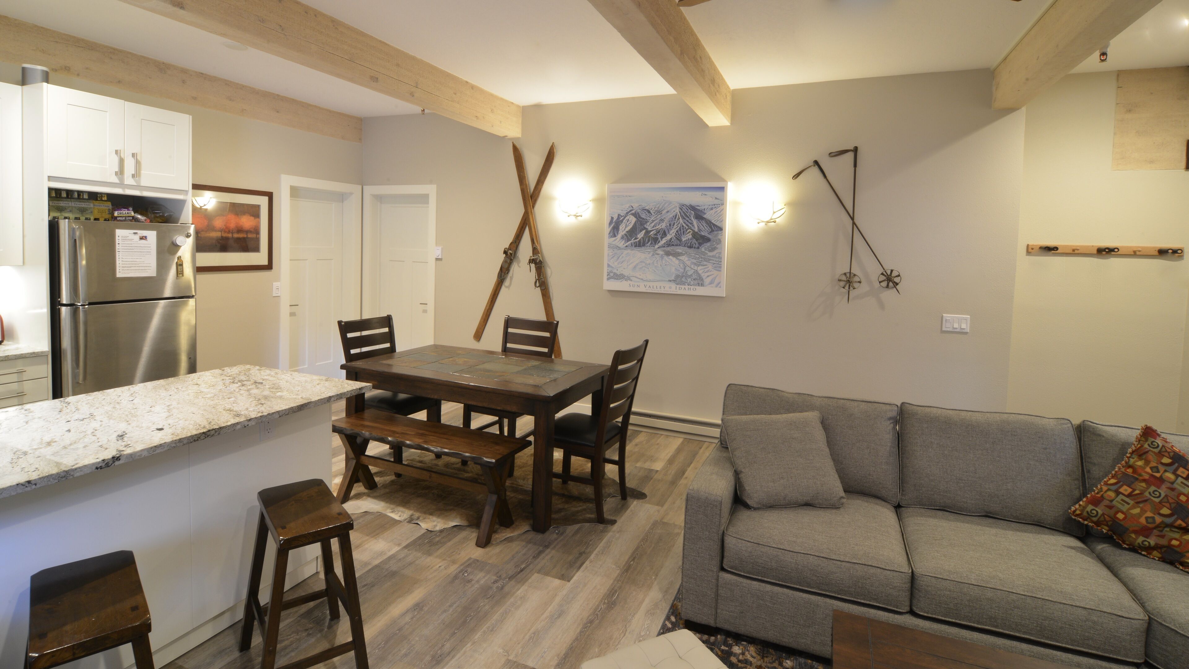 A compact living space with a kitchen, dining area, and seating area.
