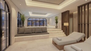 Un intérieur moderne comprenant un coin salon, un escalier et une vue dégagée grâce à de grandes fenêtres.