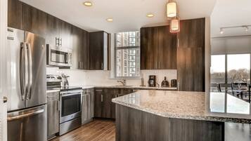 Luxury Apartment, 2 Bedrooms | Private kitchen | Full-size fridge, microwave, oven, stovetop