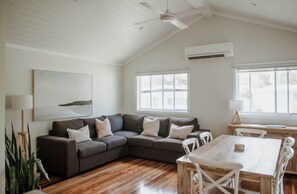 Deluxe Cabin, 2 Bedrooms | Living area | 32-inch Smart TV with digital channels - Surfside Cudmirrah Beach (Cudmirrah)