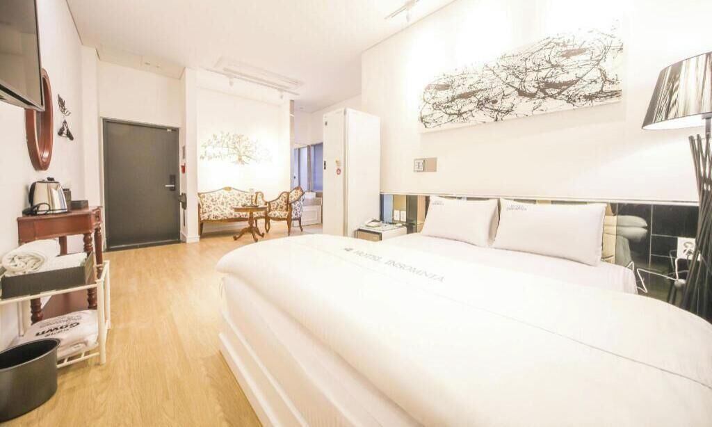 Premium bedding, memory foam beds, laptop workspace, blackout drapes