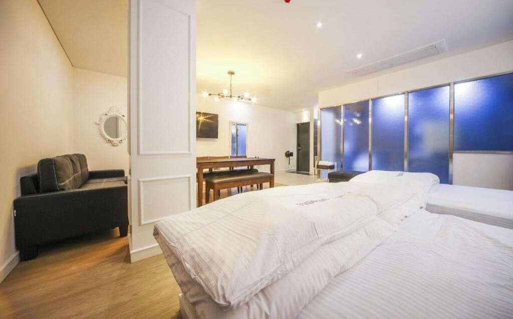 Premium bedding, memory foam beds, laptop workspace, blackout drapes