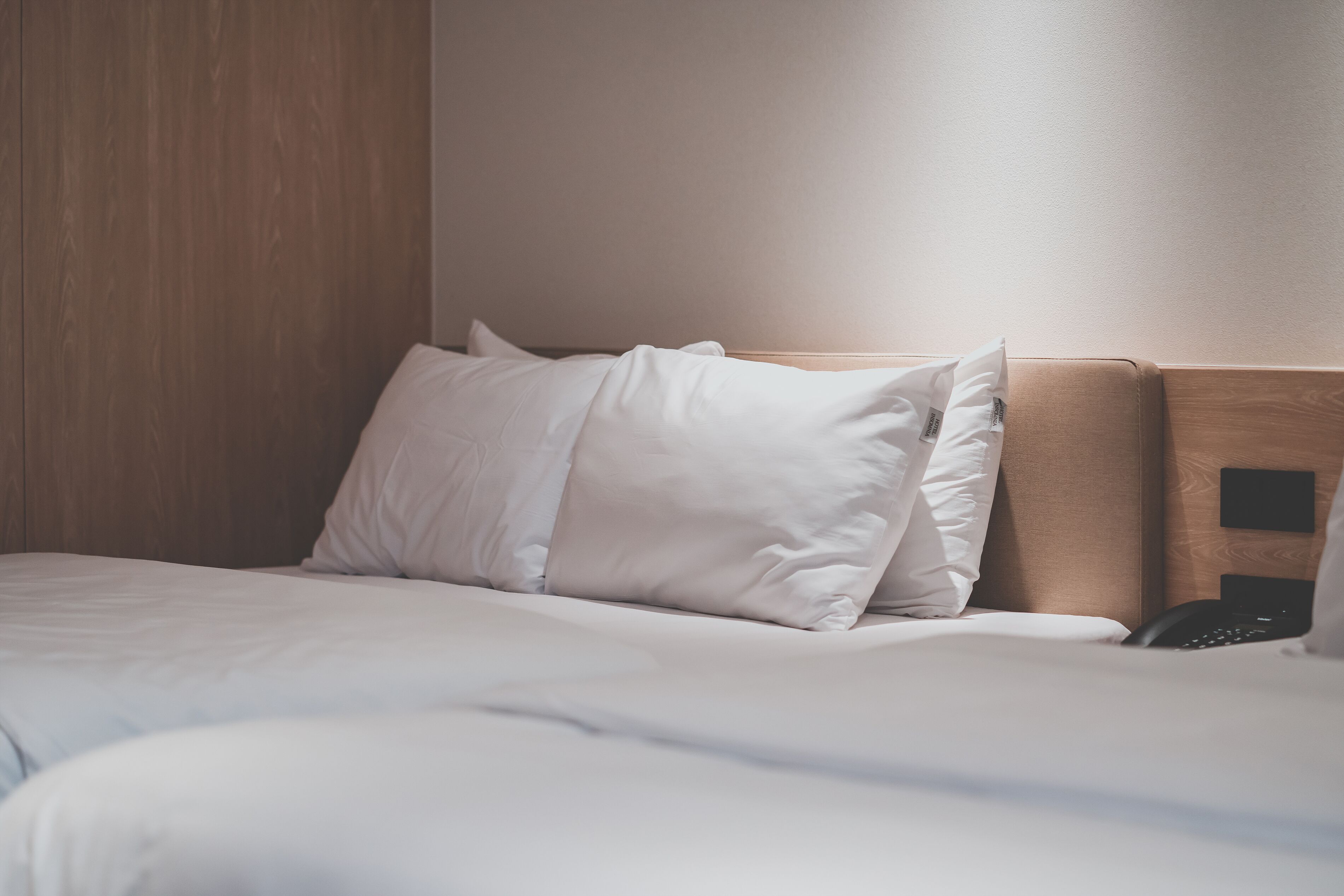 Premium bedding, memory-foam beds, laptop workspace, blackout curtains
