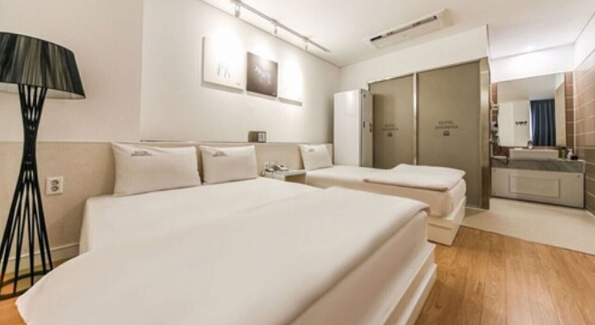 Premium bedding, memory foam beds, laptop workspace, blackout drapes