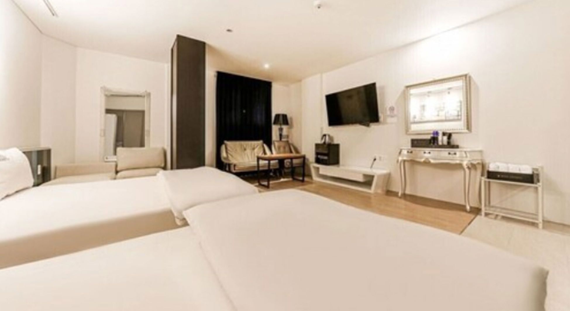 Premium bedding, memory foam beds, laptop workspace, blackout drapes