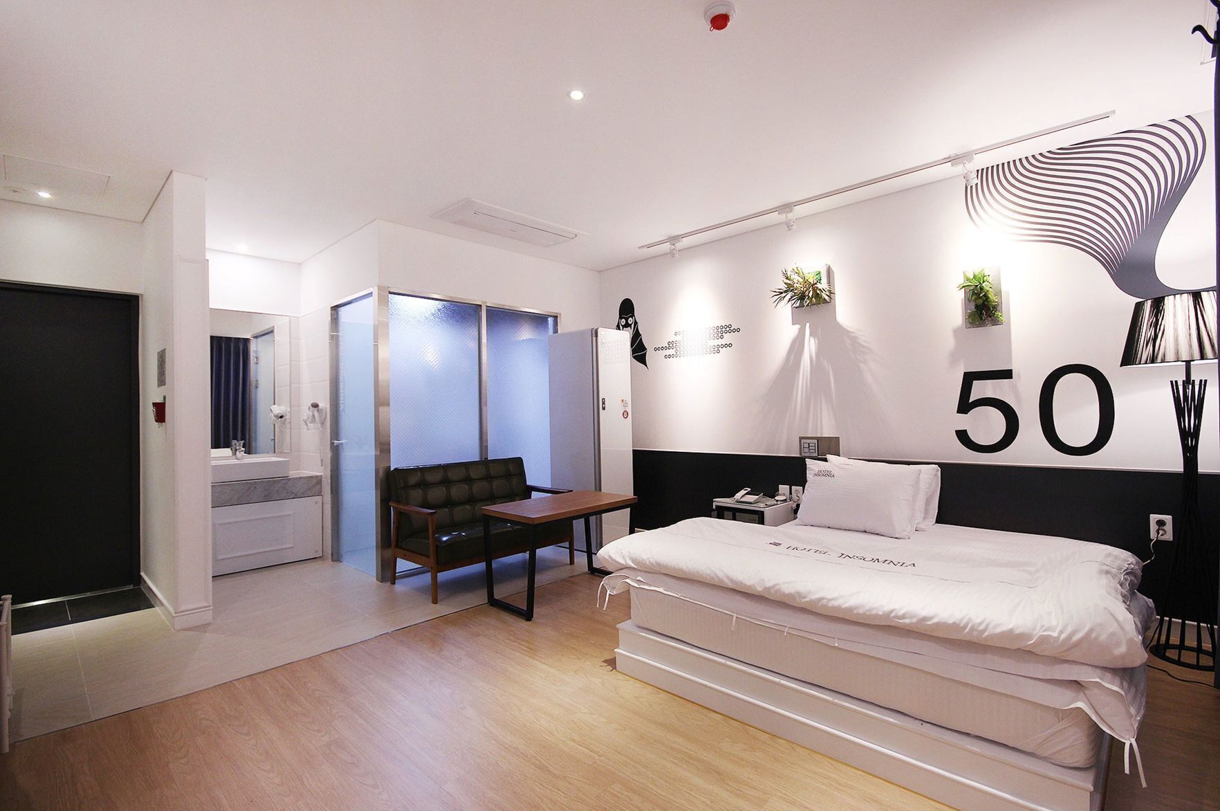 Premium bedding, memory foam beds, laptop workspace, blackout drapes