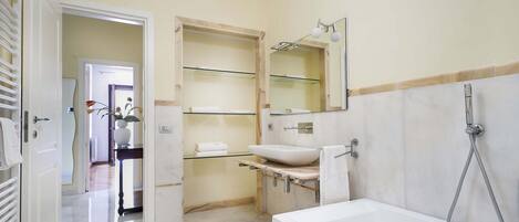 Bathtub, hair dryer, towels