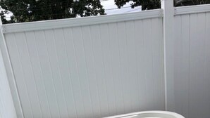 A hot tub with a control panel, set on a wooden deck with a white fence in the background. - Walk to Downtown/The Landing! Beautiful cottage, cozy private hot tub! (Branson)