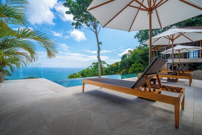Wake up to the sounds of the jungle and dramatic views of the sea