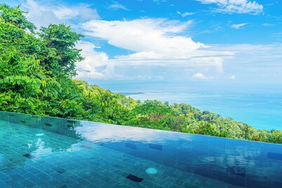 Wake up to the sounds of the jungle and dramatic views of the sea