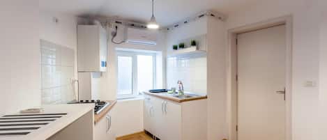 Fridge, microwave, stovetop, coffee/tea maker