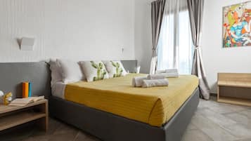 Panoramic Quadruple Room, Balcony, Sea View | Minibar, in-room safe, desk, blackout drapes