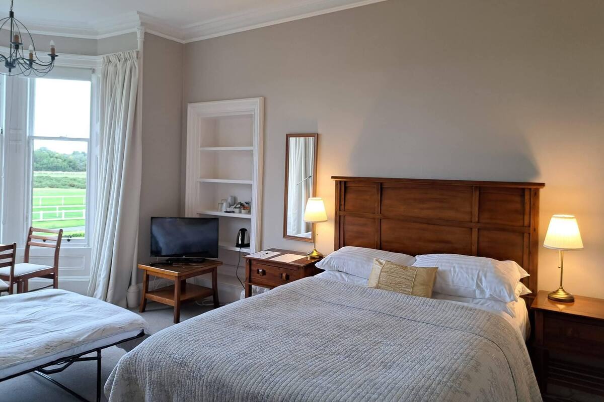 Economy Double Room, 1 Queen Bed with Sofa bed, Golf View, Shared Bathroom | Blackout drapes, iron/ironing board (on request), WiFi (free)