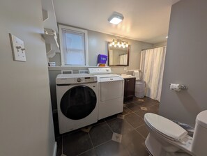 Combined shower/tub, hair dryer, towels, soap