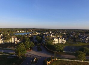 A residential area with houses, a lake, and a clear sky. - Kinsale (Davenport)