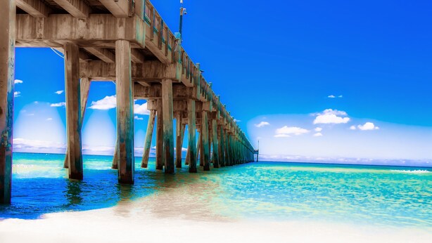 A pier extending into a clear blue sea with a sandy beach at the end. - Gulf Front 2BR Condo• 2 Balconies • Panoramic Gulf Views • Starboard Village 422 (Pensacola Beach)