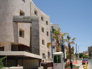 A hotel with a modern design, featuring a prominent sign for 'Suites & Hotel'. - Beity Rose Suites Hotel (Amman)