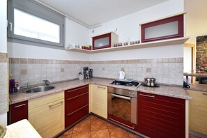 Departamento Premium, 2 camas individuales | Cocina privada | Refrigerador, horno, parrilla de estufa y utensilios de cocina 