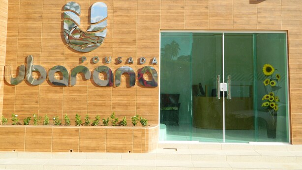 A building facade with a logo and the name 'Pousada'. - Pousada Ubarana (Maragogi)