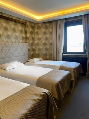 Standard Triple Room | Premium bedding, in-room safe, desk, soundproofing - Gold City Hotel (Bursa)