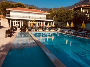 Outdoor pool, pool umbrellas, pool loungers