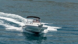 A speedboat on water. - Villa Eight by A (Okrug)