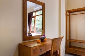 A wooden desk with a mirror, a chair, and a window with curtains. - Alam Pangkung Ubud (Ubud)