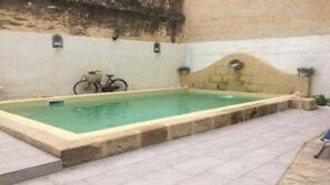 Seasonal outdoor pool, pool loungers