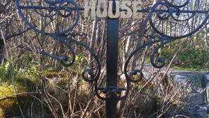 A sign for 'DISBLIND HOUSE' with a decorative metal frame. - Disblair House (Aberdeen)