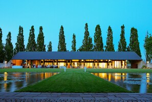 A modern hotel with a flat roof, large windows, and a well-maintained lawn in front. - Corte d'Acqua (Abano Terme)