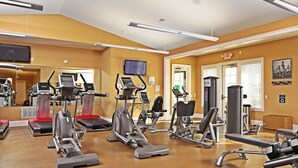 A gym with treadmills, elliptical machines, and weight equipment. - BridgeStreet at Hilliard Grand (Dublin)