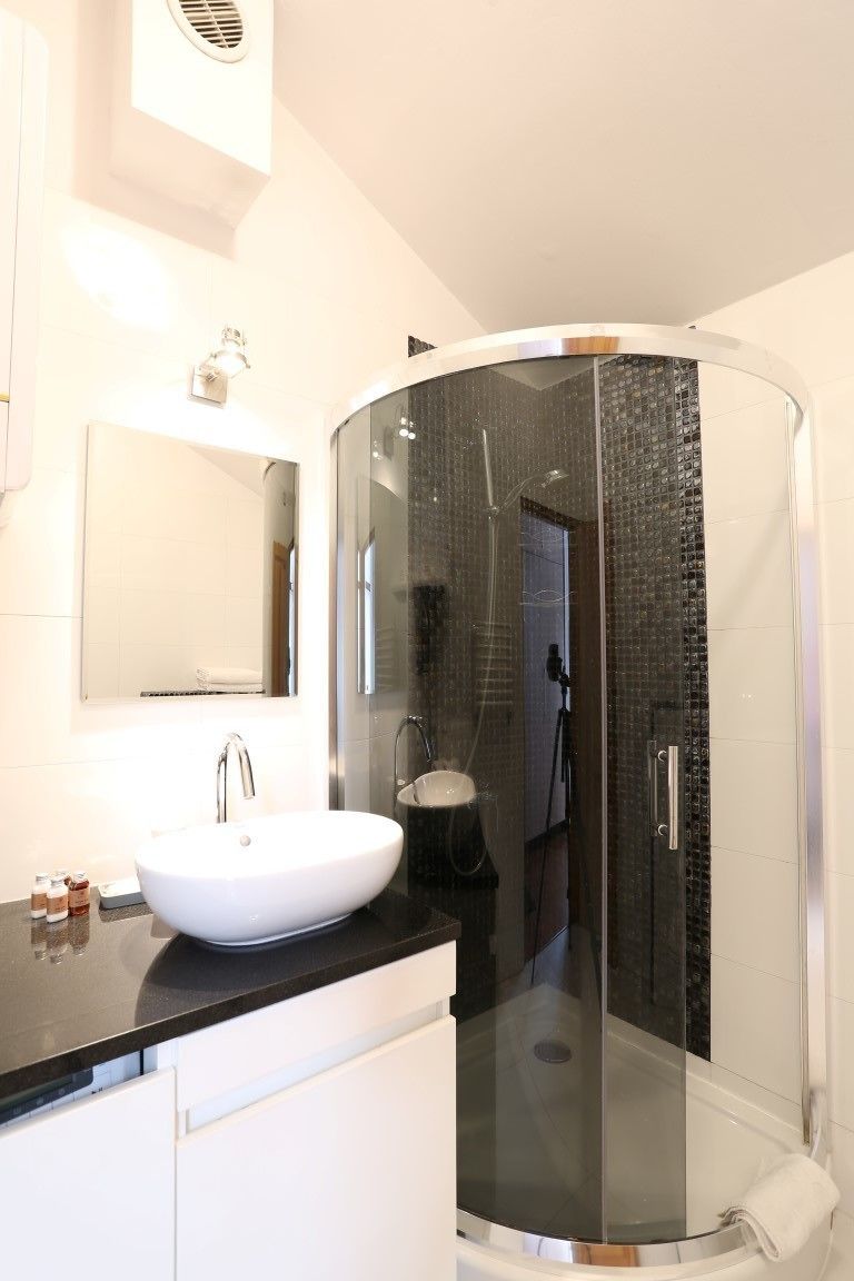 grand apartment | bathroom | designer toiletries, hair dryer, slippers, towels