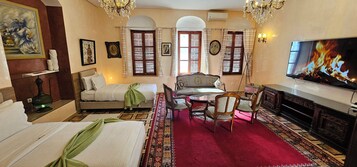 Deluxe Room, 1 Bedroom | In-room safe, individually decorated, desk, laptop workspace