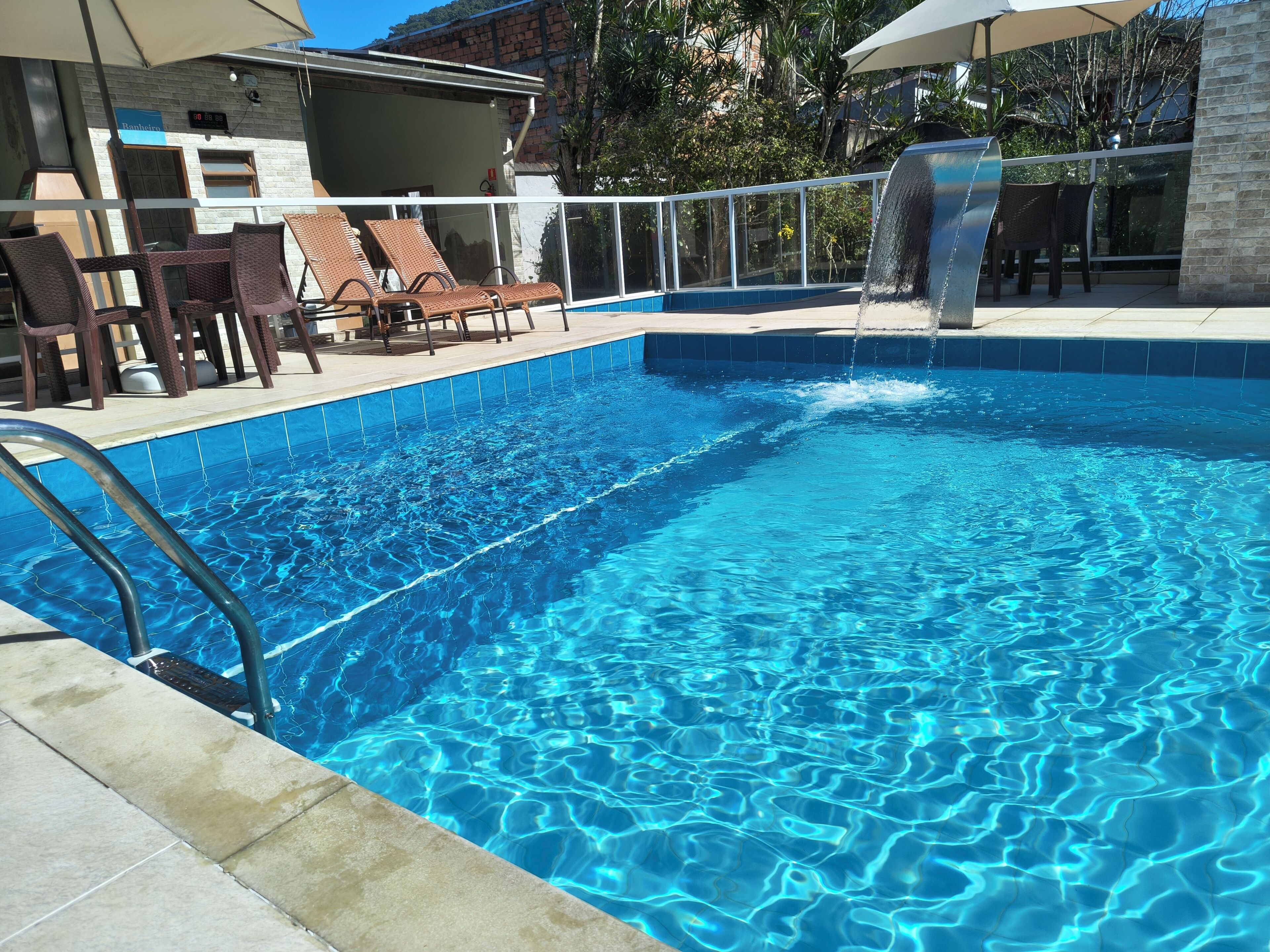 2 outdoor pools, open 10 AM to 9 PM, pool umbrellas