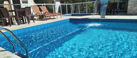 2 outdoor pools, open 10 AM to 9 PM, pool umbrellas