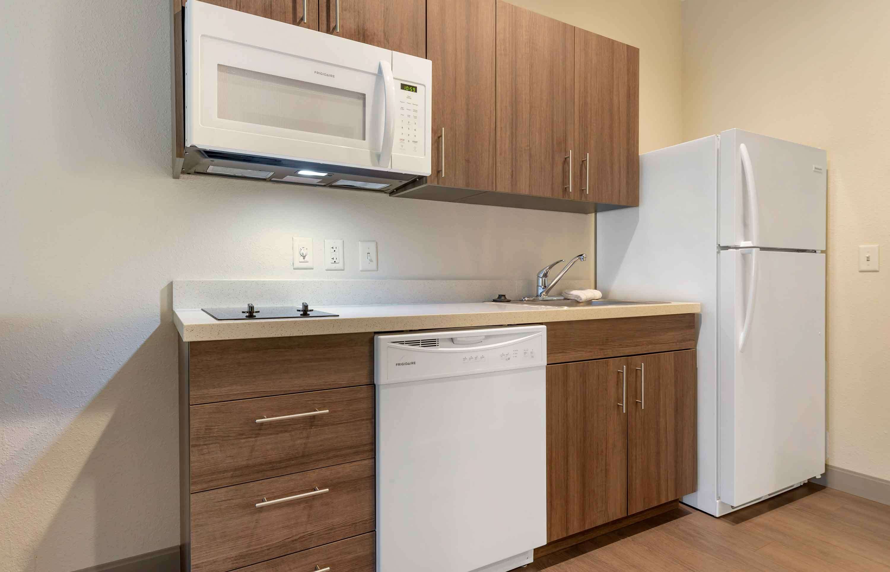studio, 1 queen bed, non smoking | private kitchen | full-sized fridge, microwave, stovetop, cookware/dishes/utensils