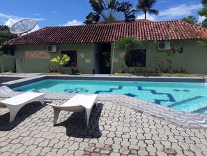 Outdoor pool, open 9 AM to 10 PM, pool umbrellas, pool loungers