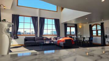 Apartment, 4 Bedrooms, Balcony | Living area | Flat-screen TV