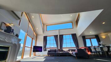Apartment, 4 Bedrooms, Balcony | Living area | Flat-screen TV