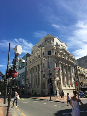 A historic building with classical architecture, including columns and decorative moldings. - U Suites on Manners (Wellington)