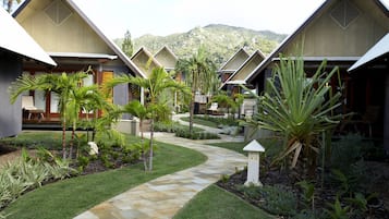 Set amidst lush tropical gardens, this resort features modern two-story buildings with flat roofs and angular lines.